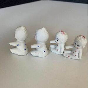 4 white miniature baby figurines lot